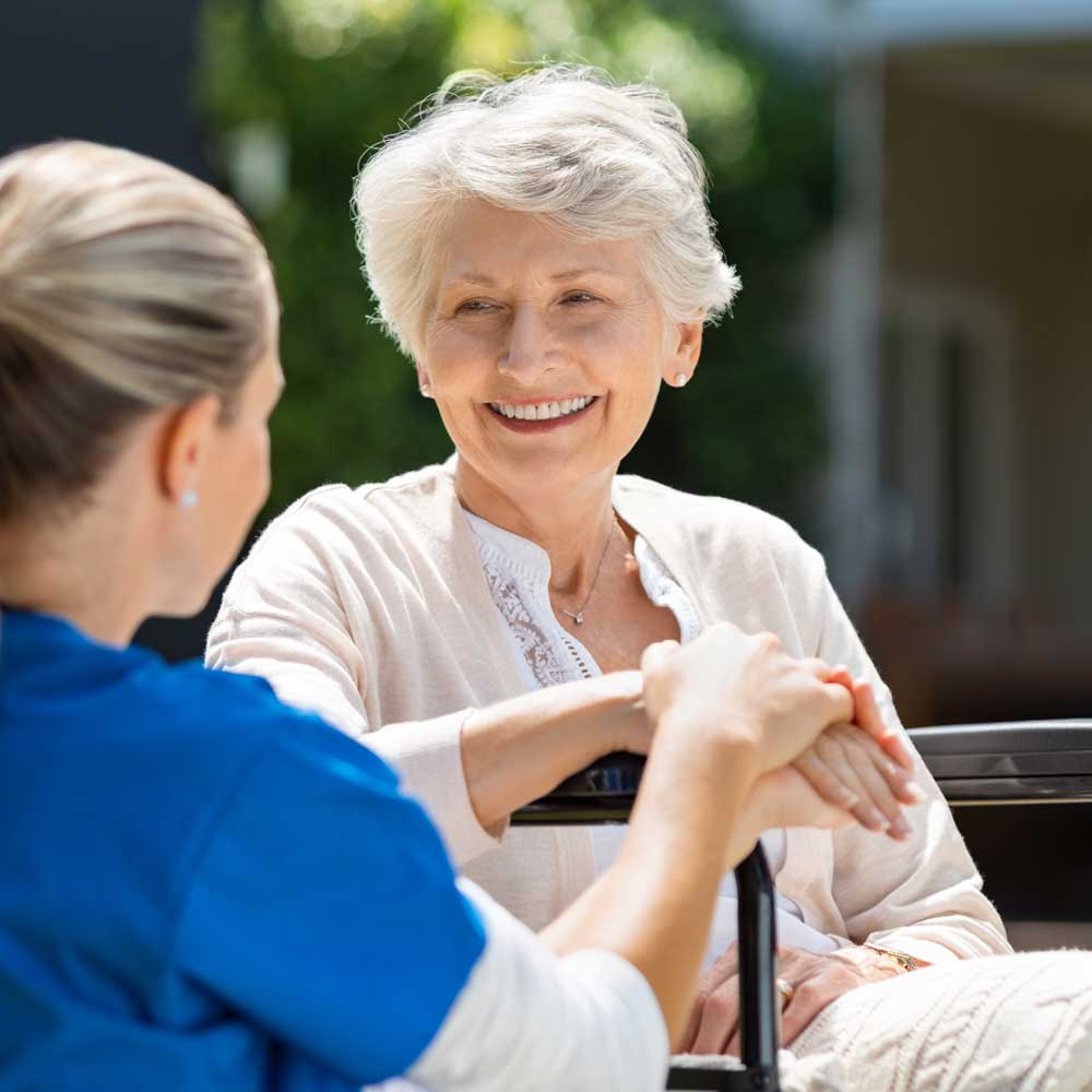 Nurse takes care of old patient